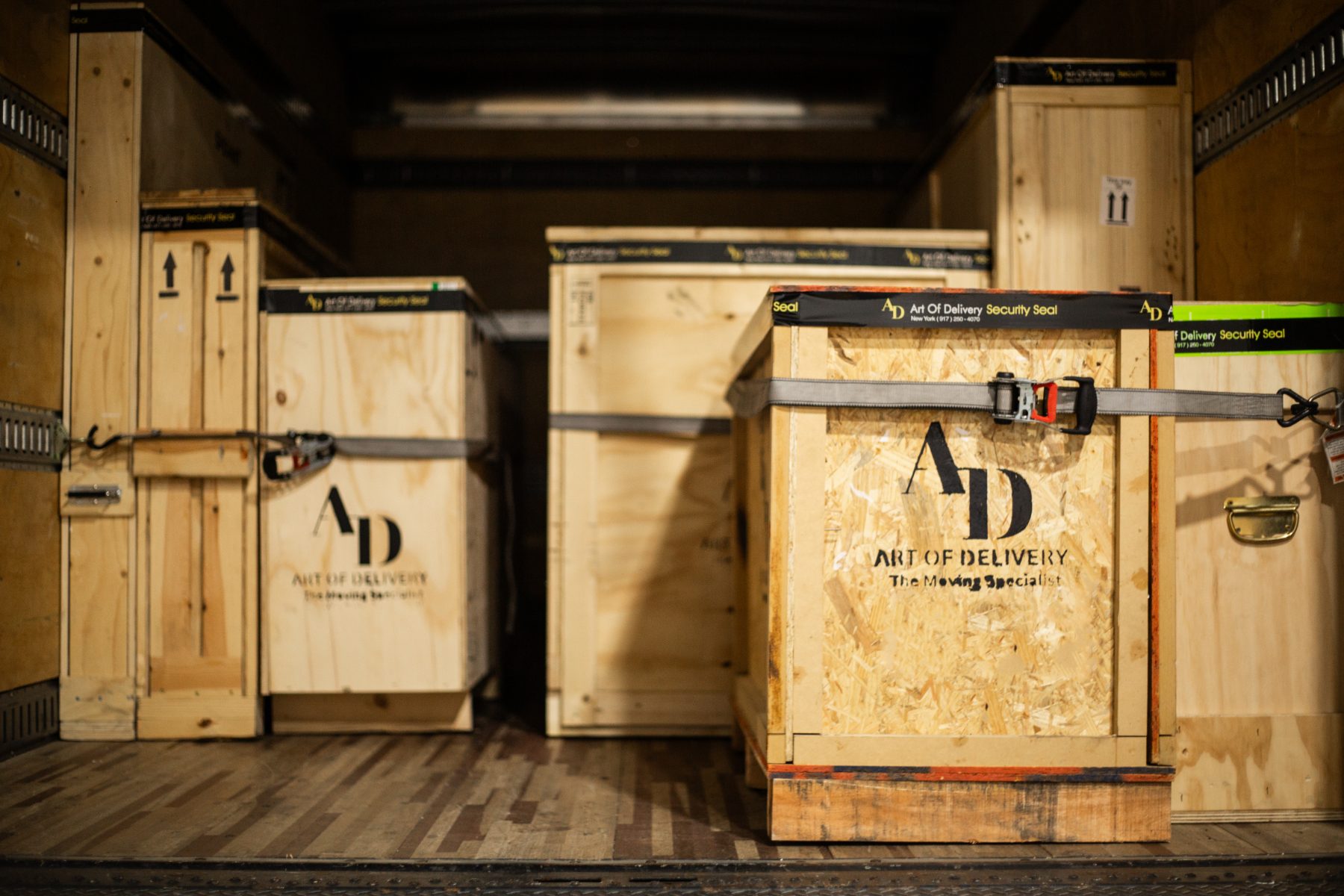 Branded crates strapped and secured inside the truck
